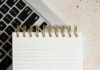 15 Best AI Content Tools in 2025: Scale Quality & E-E-A-T Notepad on a laptop for AI-assisted content writing