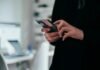 Google AI Mode in India: How It Works and What Site Owners Should Do Person holding a smartphone to search with Google AI Mode